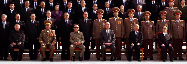 Image: North Korea's leader Kim Jong-il sits with his youngest son Kim Jong-un and younger sister Kim Kyong-hui poses in Pyongyang